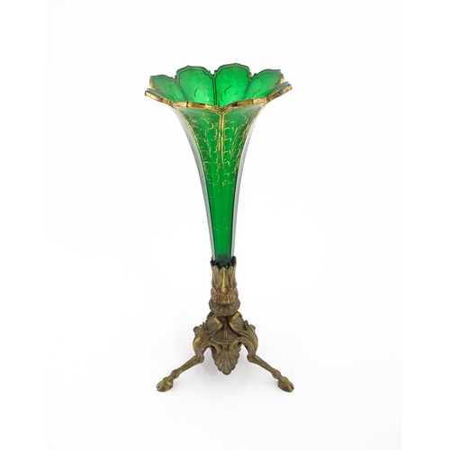 240 - A Victorian epergne, the green glass flute with gilt highlights on a gilt metal triform base. Approx... 