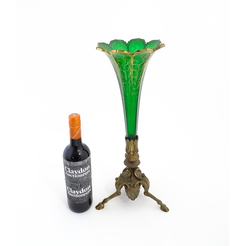 240 - A Victorian epergne, the green glass flute with gilt highlights on a gilt metal triform base. Approx... 