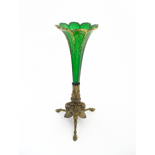 240 - A Victorian epergne, the green glass flute with gilt highlights on a gilt metal triform base. Approx... 