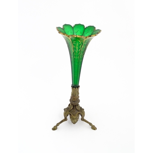 240 - A Victorian epergne, the green glass flute with gilt highlights on a gilt metal triform base. Approx... 