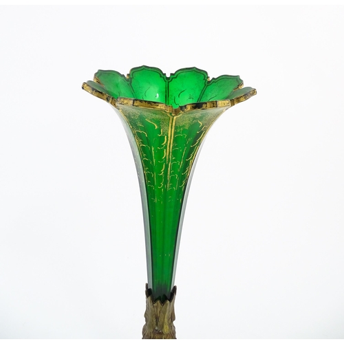 240 - A Victorian epergne, the green glass flute with gilt highlights on a gilt metal triform base. Approx... 