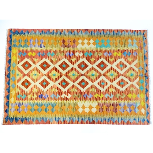 1391 - Carpet / Rug : A Turkish Anatolian kilim rug with repeating geometric motifs. Approx. 72