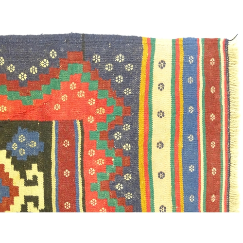 1392 - Carpet / Rug : A North East Persian Sumak kilim rug with banded geometric decoration. Approx. 79