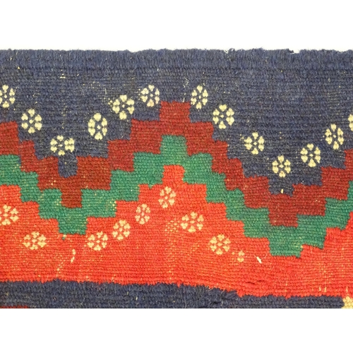 1392 - Carpet / Rug : A North East Persian Sumak kilim rug with banded geometric decoration. Approx. 79