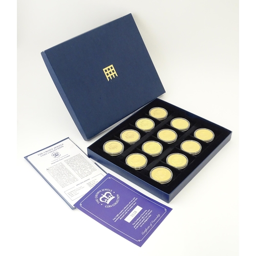 896 - Coins: A boxed set of twelve Westminster Mint gold plated medallions titled the Crown Jewels Coin Co... 