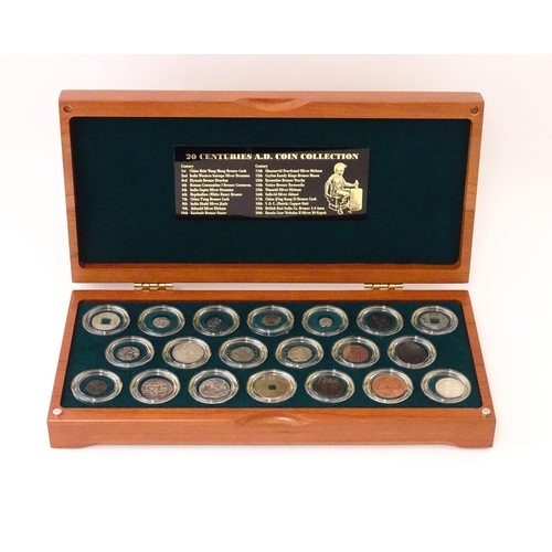 897 - Coins: A cased collection of coins titled The Twenty Centuries AD - Coin Collection, produced by the... 