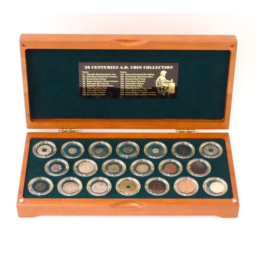 897 - Coins: A cased collection of coins titled The Twenty Centuries AD - Coin Collection, produced by the... 