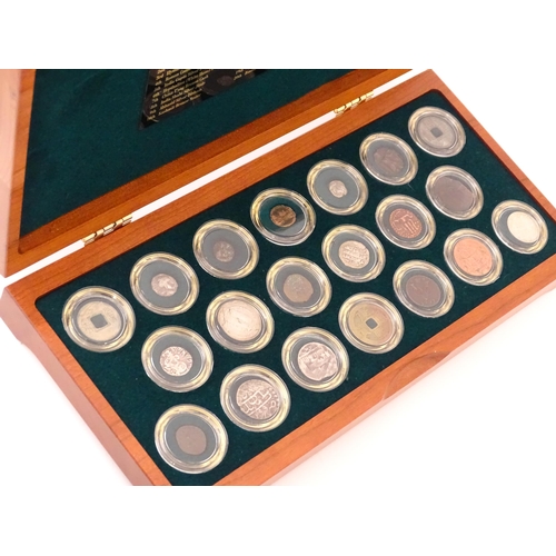 897 - Coins: A cased collection of coins titled The Twenty Centuries AD - Coin Collection, produced by the... 