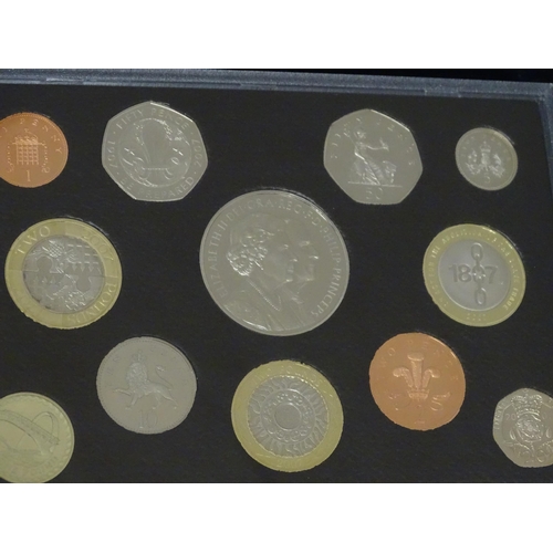 900 - Coins: A quantity of Queen Elizabeth II United Kingdom Royal Mint proof coin collections for the yea... 