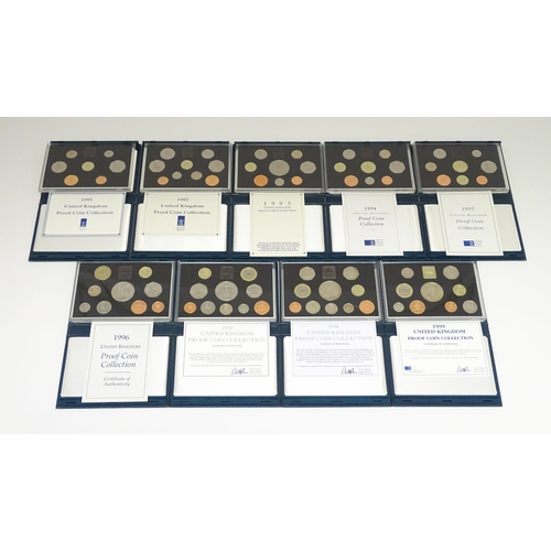 901 - Coins: A quantity of Queen Elizabeth II United Kingdom Royal Mint proof coin collections for the yea... 