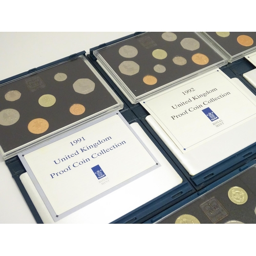 901 - Coins: A quantity of Queen Elizabeth II United Kingdom Royal Mint proof coin collections for the yea... 