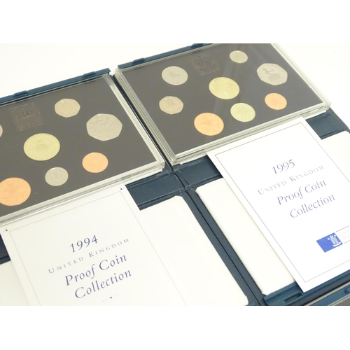 901 - Coins: A quantity of Queen Elizabeth II United Kingdom Royal Mint proof coin collections for the yea... 