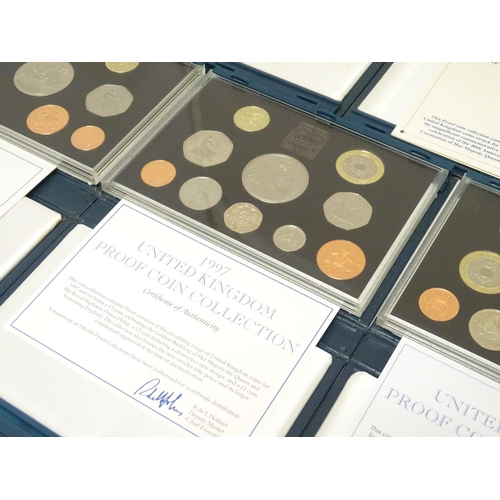 901 - Coins: A quantity of Queen Elizabeth II United Kingdom Royal Mint proof coin collections for the yea... 