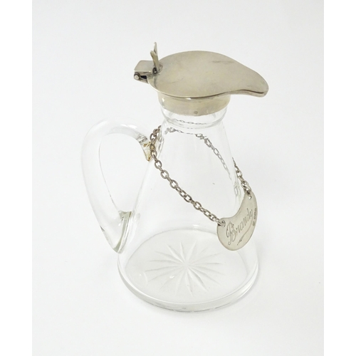 245 - A glass whisky water noggin / jug with silver lid, hallmarked Birmingham 1931. Together with matchin... 