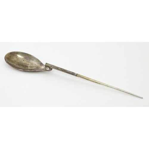 254 - A silver replica of a Roman Christening spoon, indistinctly marked. Approx. 8 1/4