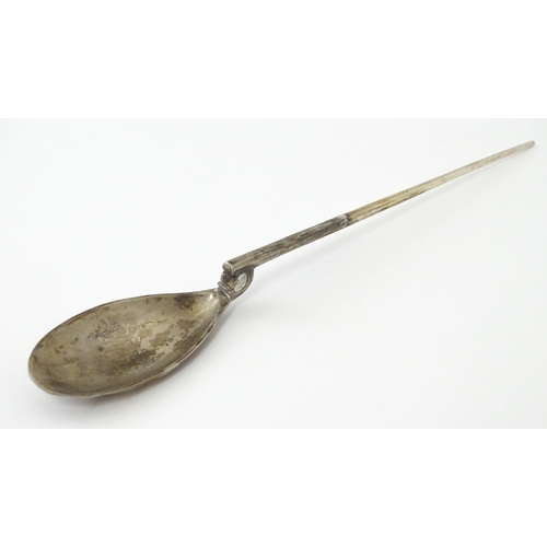 254 - A silver replica of a Roman Christening spoon, indistinctly marked. Approx. 8 1/4