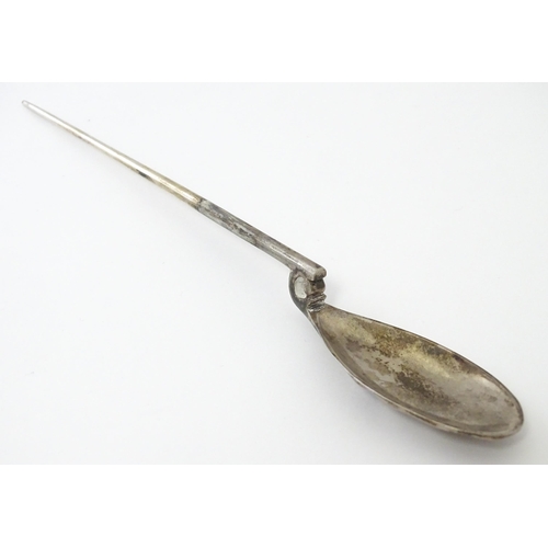 254 - A silver replica of a Roman Christening spoon, indistinctly marked. Approx. 8 1/4