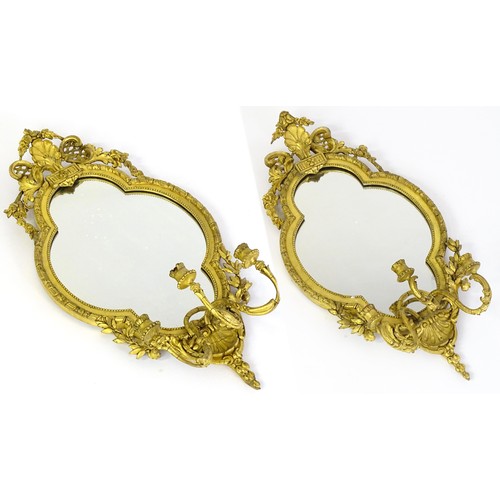 1501 - A pair of 19thC giltwood and gesso girandoles with shell motifs, lattice pattern mouldings, fluted d... 