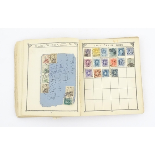 2147 - Stamps / Postal History: An early 20thC postage stamp album, containing numerous affixed worldwide s... 