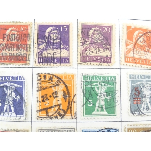 2147 - Stamps / Postal History: An early 20thC postage stamp album, containing numerous affixed worldwide s... 