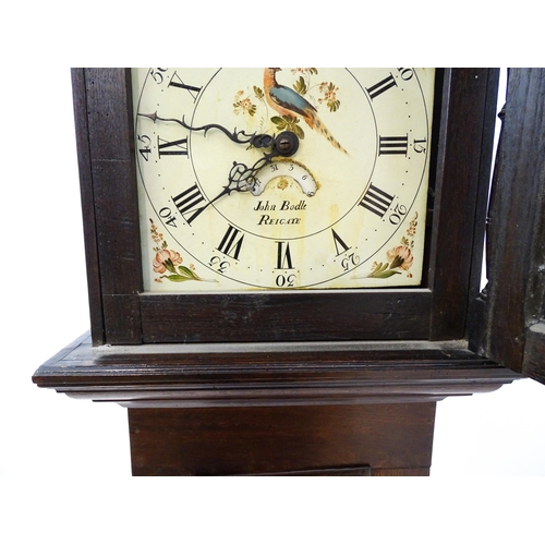 1430 - John Bodle - Reigate : An oak cased 30 hour longcase clock the painted dial having Roman numeral hou... 