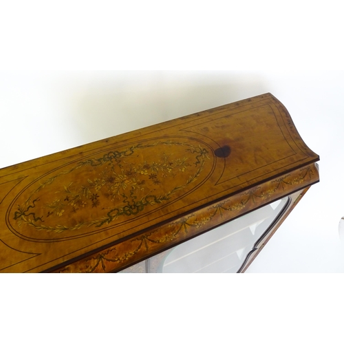 1475 - A late 19thC satinwood bookcase with a profusely inlaid frame with satinwood, box wood and fruit woo... 