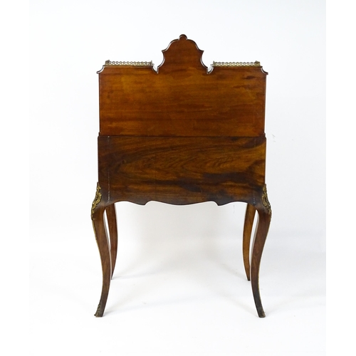 1476 - A 19thC burr walnut Bonheur du jour with a mirrored back stand and flanked by two glazed cabinets wi... 