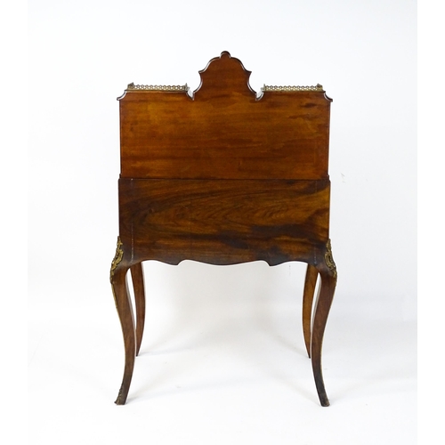 1476 - A 19thC burr walnut Bonheur du jour with a mirrored back stand and flanked by two glazed cabinets wi... 