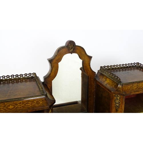 1476 - A 19thC burr walnut Bonheur du jour with a mirrored back stand and flanked by two glazed cabinets wi... 