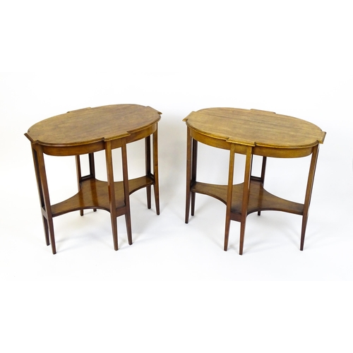 1480 - A pair of late 19thC / early 20thC mahogany side tables, each with shaped tops and having eight tape... 