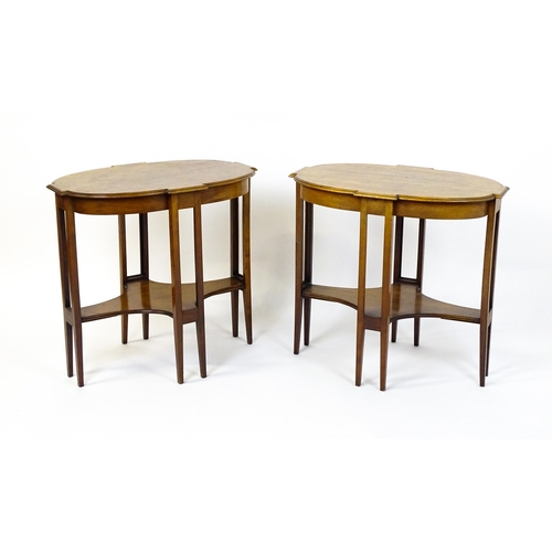 1480 - A pair of late 19thC / early 20thC mahogany side tables, each with shaped tops and having eight tape... 