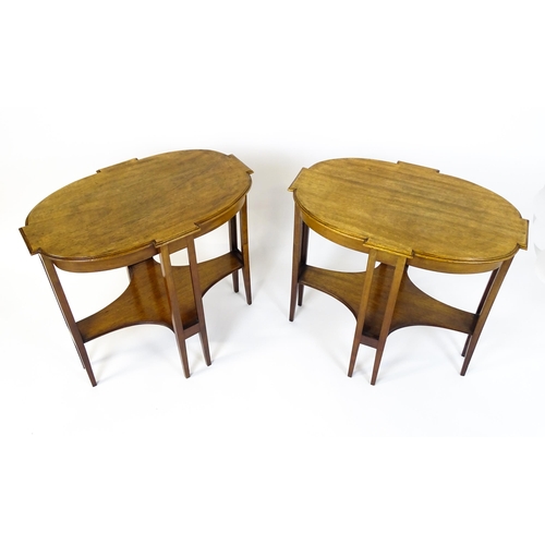 1480 - A pair of late 19thC / early 20thC mahogany side tables, each with shaped tops and having eight tape... 