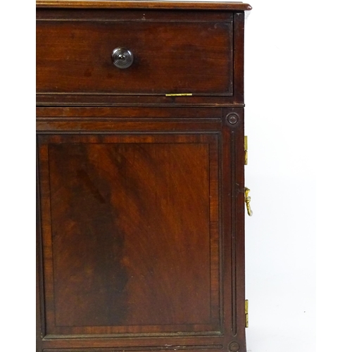 1486 - A Georgian mahogany campaign washstand with a mirror to the interior and sections for internal fitti... 