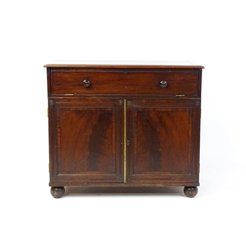 1486 - A Georgian mahogany campaign washstand with a mirror to the interior and sections for internal fitti... 