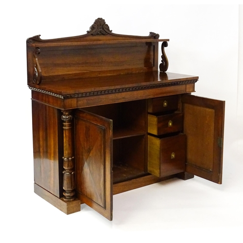 1489 - A 19thC rosewood chiffonier with a shaped upstand surmounted by a carved crest and a long shelf supp... 