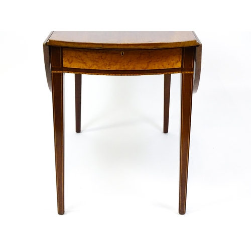 1494 - A late Georgian mahogany and satinwood Pembroke table with two demi lune drop leaves flanking a sing... 