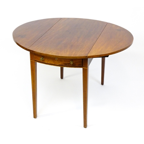 1494 - A late Georgian mahogany and satinwood Pembroke table with two demi lune drop leaves flanking a sing... 