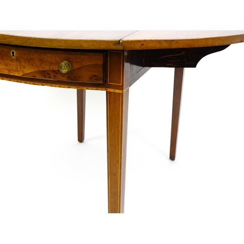 1494 - A late Georgian mahogany and satinwood Pembroke table with two demi lune drop leaves flanking a sing... 