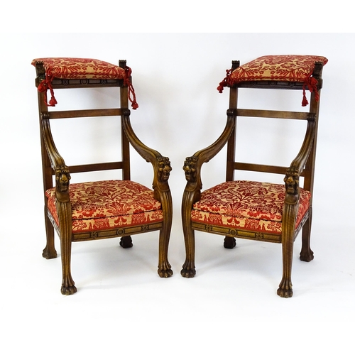 1497 - A pair of 19thC continental mahogany armchairs surmounted by corbel style reeded mounts and lions ma... 