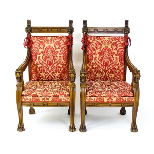 1497 - A pair of 19thC continental mahogany armchairs surmounted by corbel style reeded mounts and lions ma... 