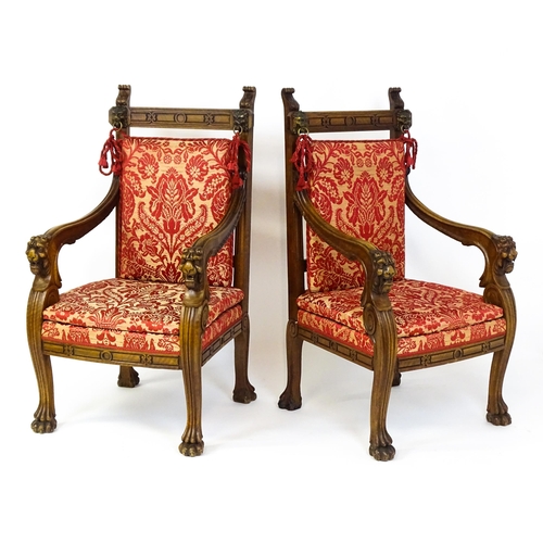 1497 - A pair of 19thC continental mahogany armchairs surmounted by corbel style reeded mounts and lions ma... 