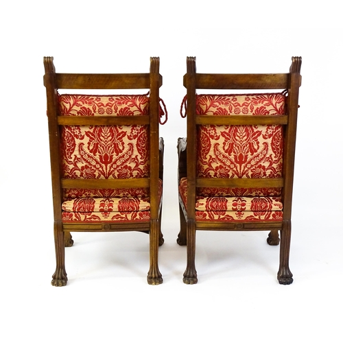 1497 - A pair of 19thC continental mahogany armchairs surmounted by corbel style reeded mounts and lions ma... 