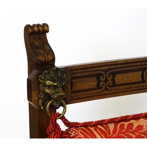 1497 - A pair of 19thC continental mahogany armchairs surmounted by corbel style reeded mounts and lions ma... 