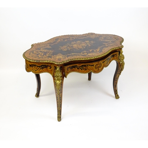 1498 - A 19thC kingwood centre table with a marquetry inlaid top having satinwood, mahogany, walnut and oth... 