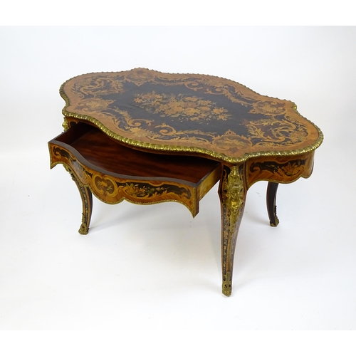 1498 - A 19thC kingwood centre table with a marquetry inlaid top having satinwood, mahogany, walnut and oth... 