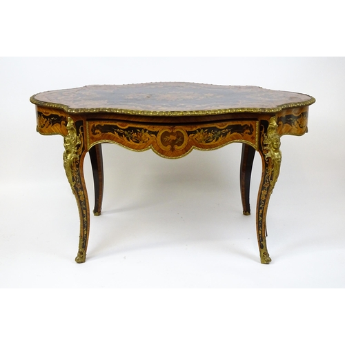 1498 - A 19thC kingwood centre table with a marquetry inlaid top having satinwood, mahogany, walnut and oth... 