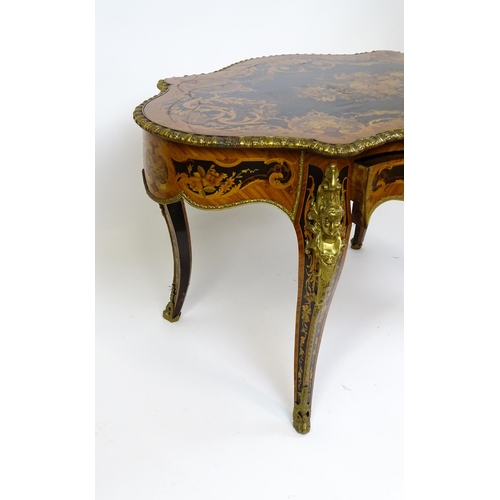 1498 - A 19thC kingwood centre table with a marquetry inlaid top having satinwood, mahogany, walnut and oth... 