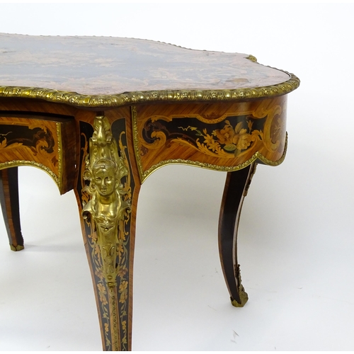 1498 - A 19thC kingwood centre table with a marquetry inlaid top having satinwood, mahogany, walnut and oth... 