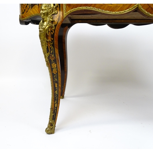 1498 - A 19thC kingwood centre table with a marquetry inlaid top having satinwood, mahogany, walnut and oth... 