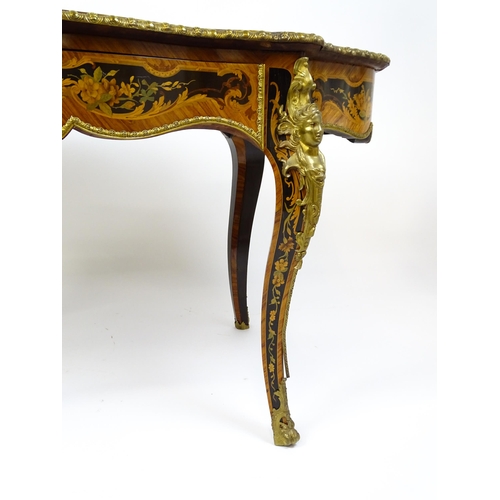 1498 - A 19thC kingwood centre table with a marquetry inlaid top having satinwood, mahogany, walnut and oth... 